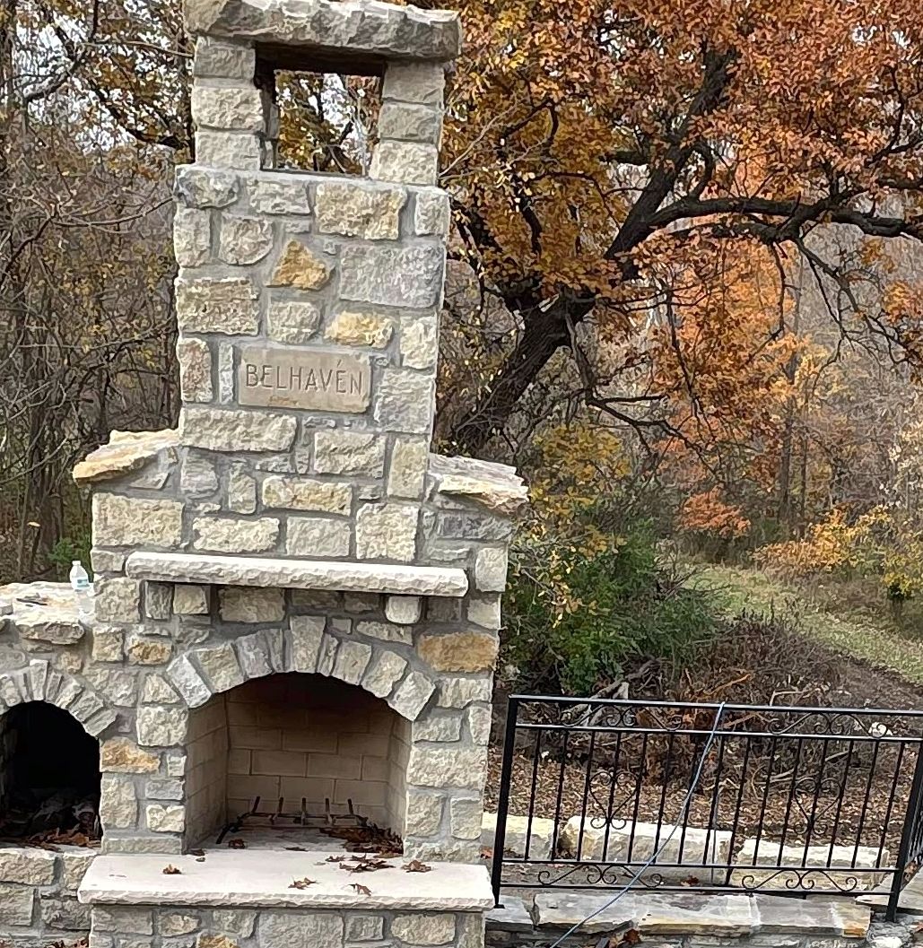 Custom outdoor stone fireplace built by Sharp Brick and Stone Kansas City