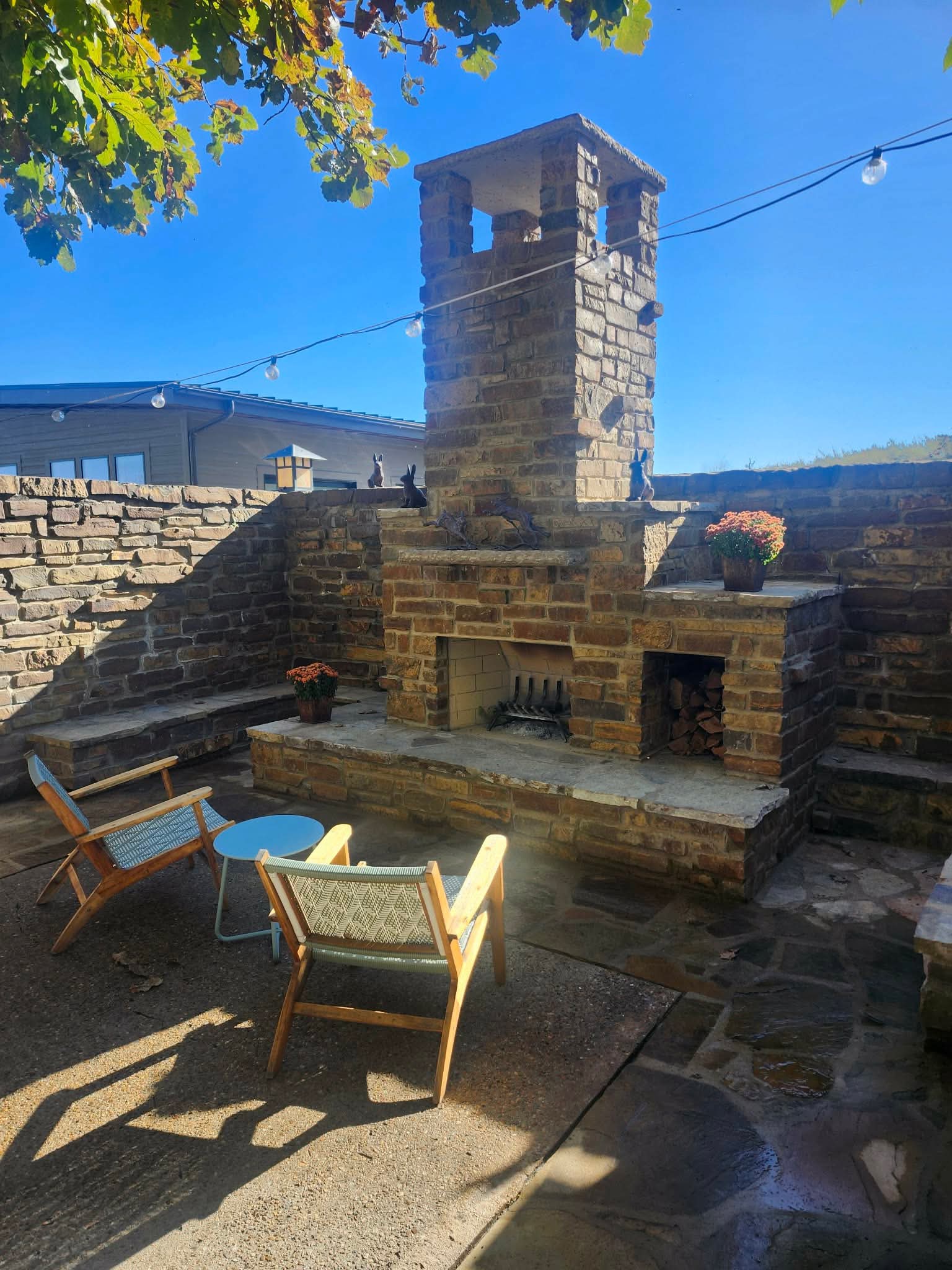 Custom outdoor stone fireplace and patio built by Sharp Brick and Stone Kansas City